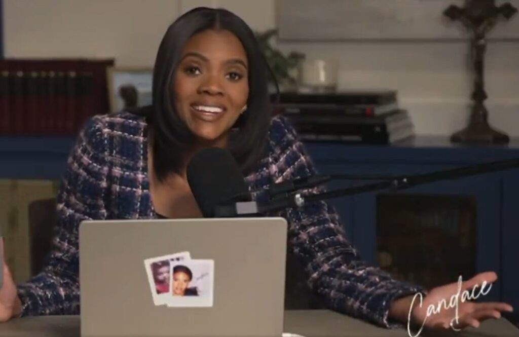 Candace Owens in front of a laptop computer