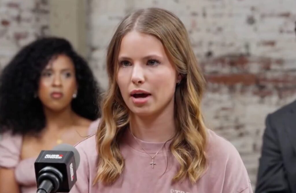 Female in her 20s sitting for debate