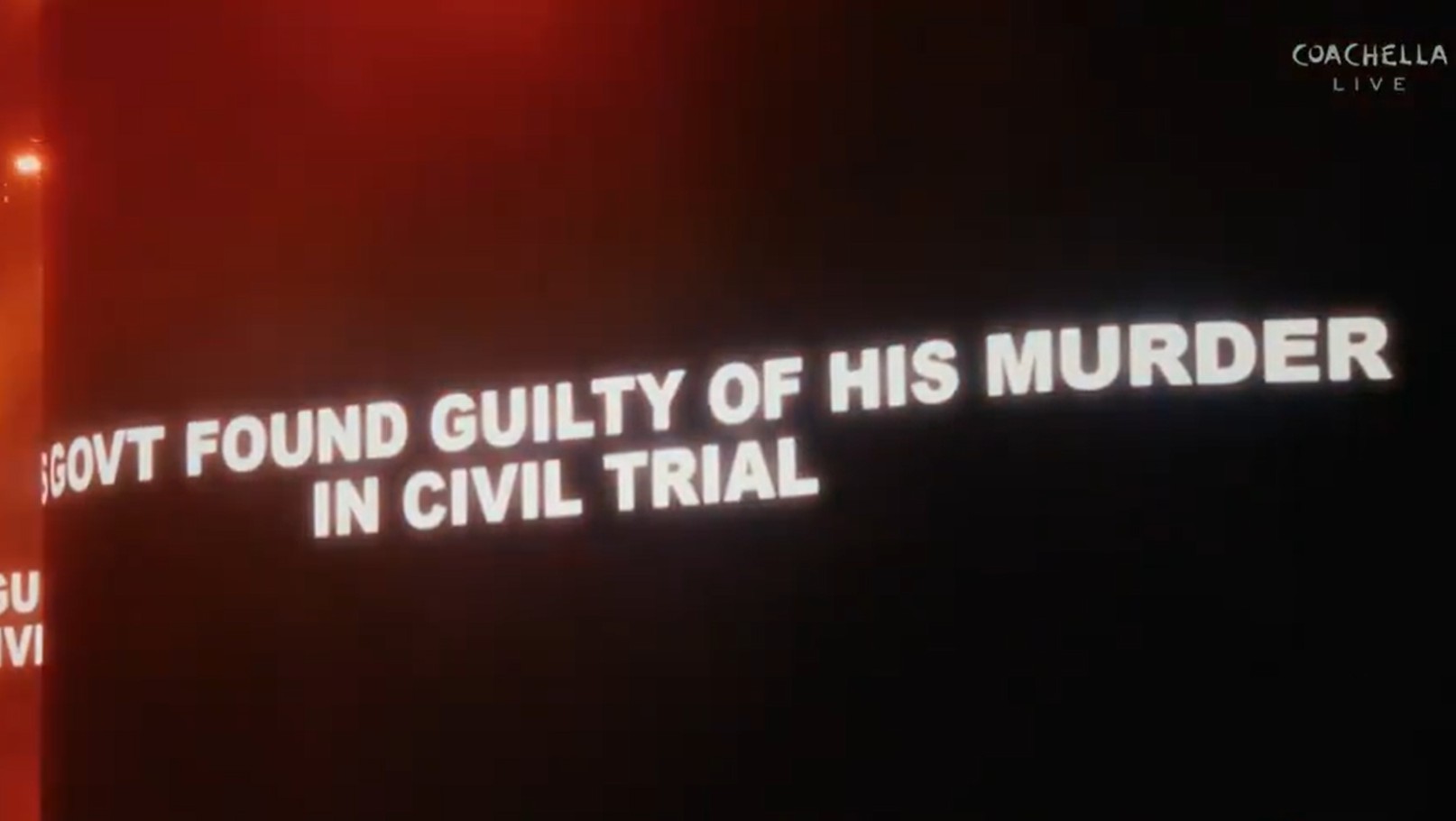 A screen with text from a concert