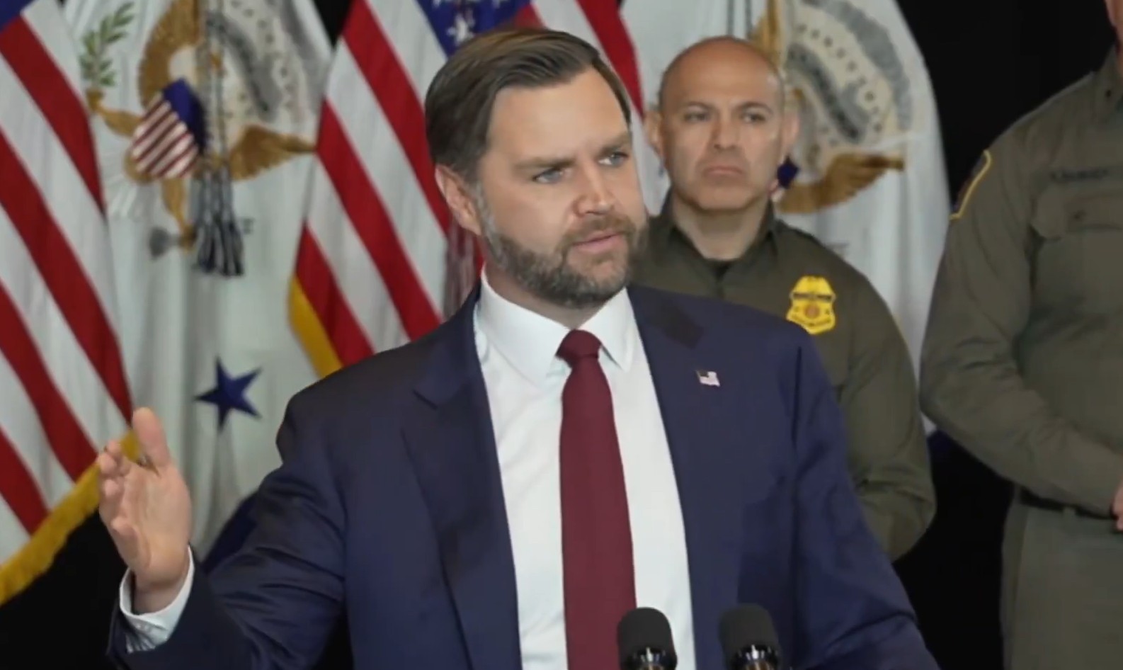 JD Vance standing during a speech