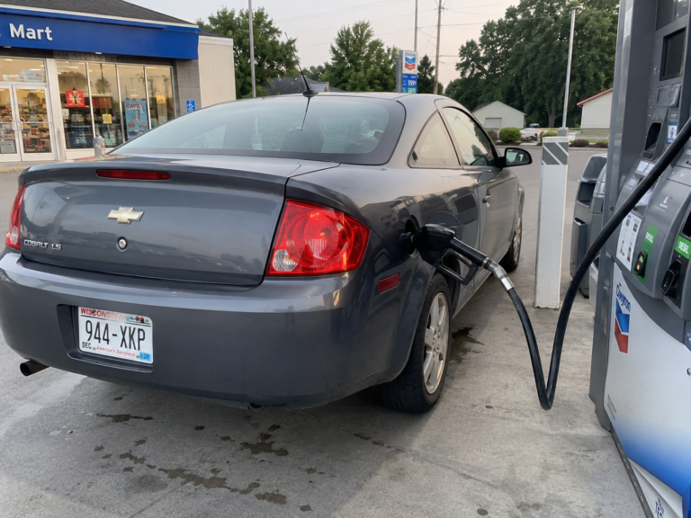 Car being filled with gas at a gas pump