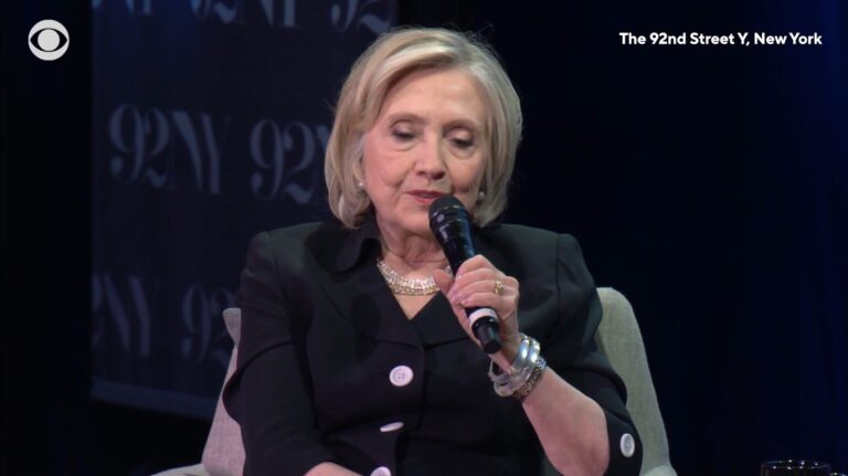 Hillary Clinton holding a microphone