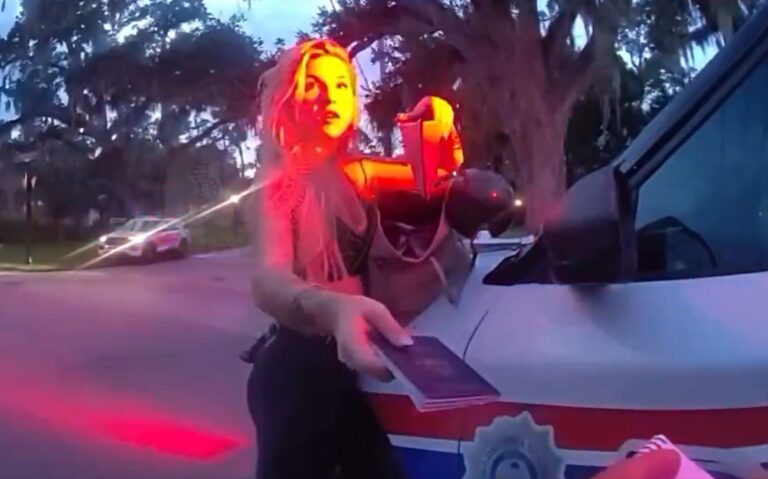 Girl leaning on police car